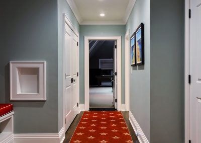 interior-designer-portfolio-mazzei-florida-house-hallway-red-carpet